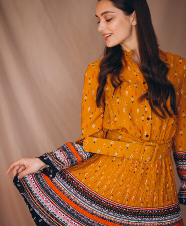 Young woman in a beautiful yellow dress in studio Young woman in a beautiful yellow dress in studio